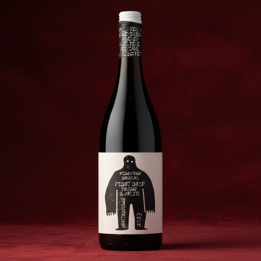 A bottle of red wine with a white label featuring a black silhouette of a person and handwritten-style text, set against a plain white background.