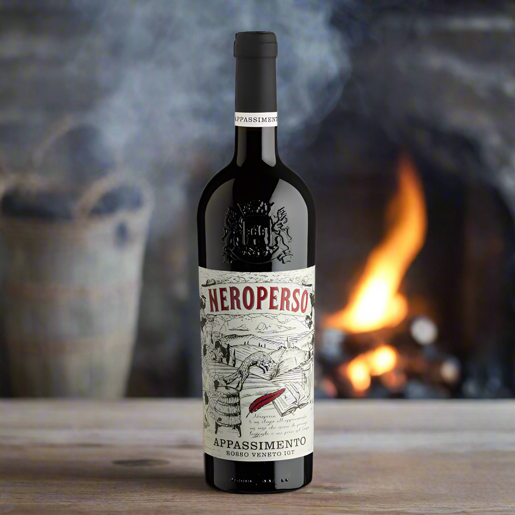 Wine bottle with a detailed label on a white background. In the background is a fire and the bottle is sat on a table